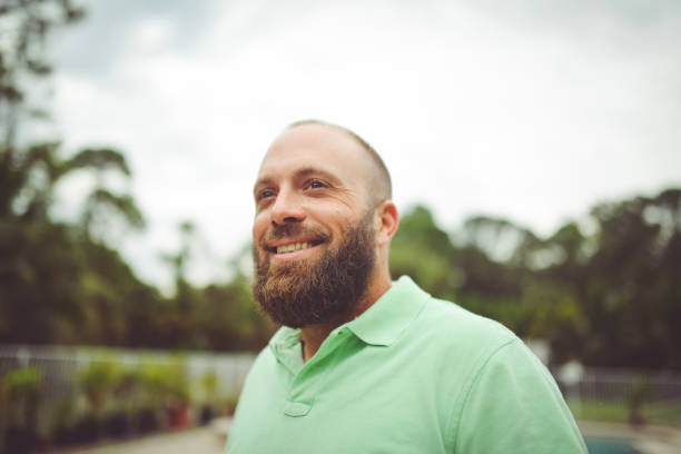 istock Handsome man with a beard outdoors in a polo shirt 1125814344