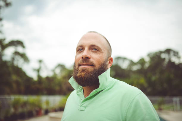 istock Handsome man with a beard outdoors in a polo shirt 1125814345