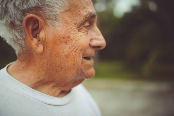 istock Man in his 90’s wears a hearing aide 1125814436