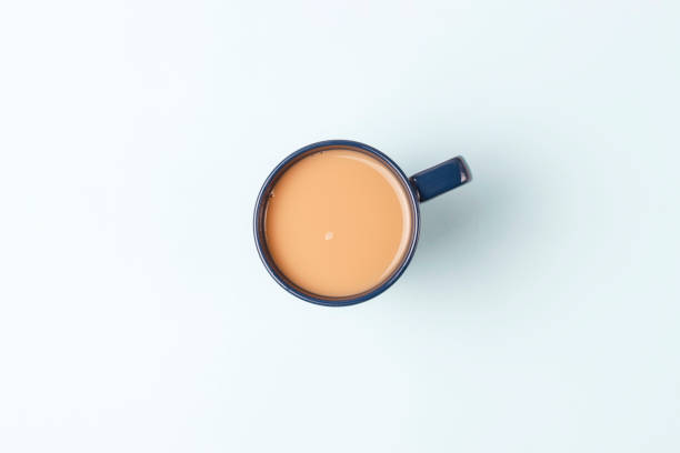 istock Cup of coffee on a blue background, top view, copy space 1125815131