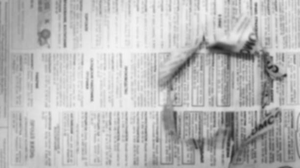 istock Newspapers with hole in page 1125815370