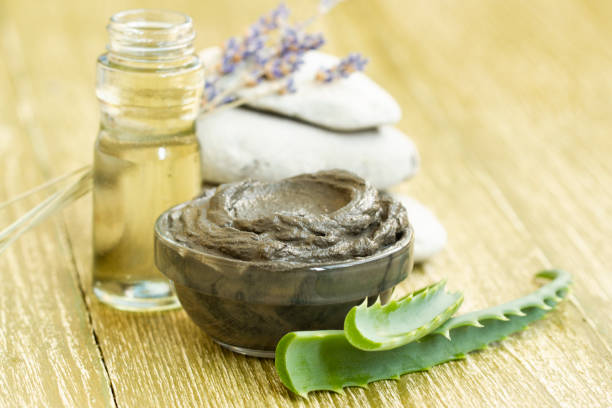 istock cosmetic mud mask with aloe vera, lavender and essential oil. 1125817749