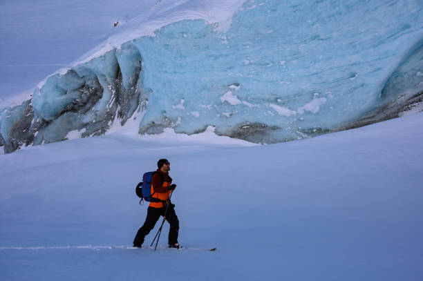 istock Backcountry skier passing an ancient glacier 1125823268
