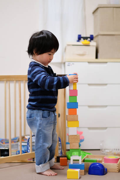 istock Child playing with toys at home 1125823300