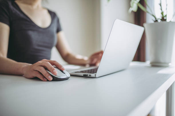 istock Laptop with woman hand 1125824160