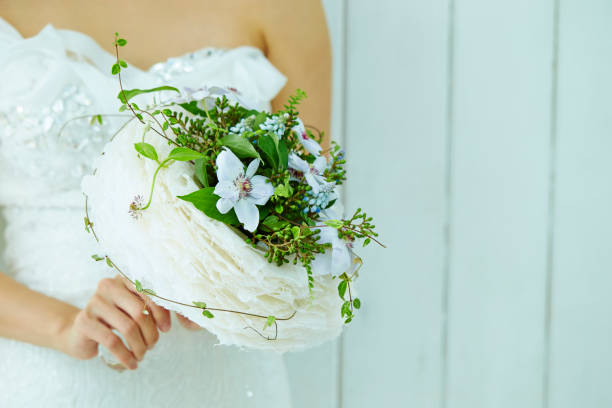Free Stock Photo of Woman in Wedding Dress Holding Bouquet of Flowers ...