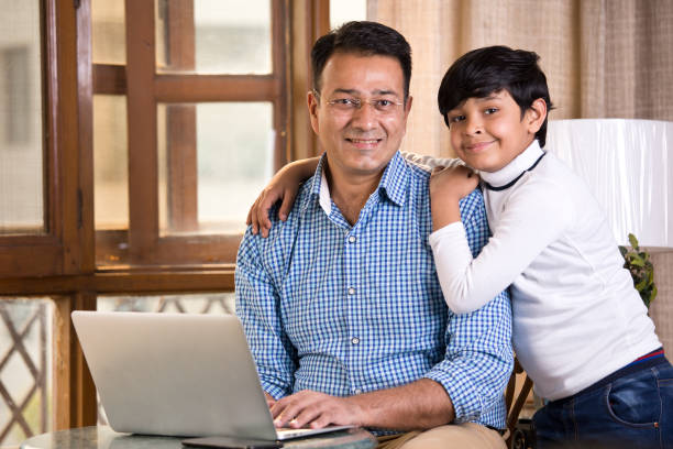 istock Son embracing his father at home 1125825048