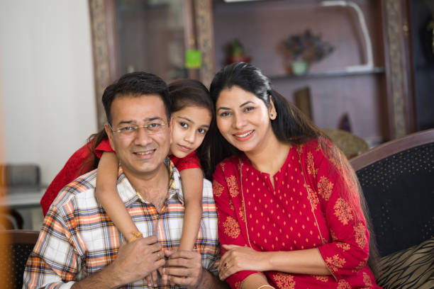 istock Happy Indian family at home 1125825321