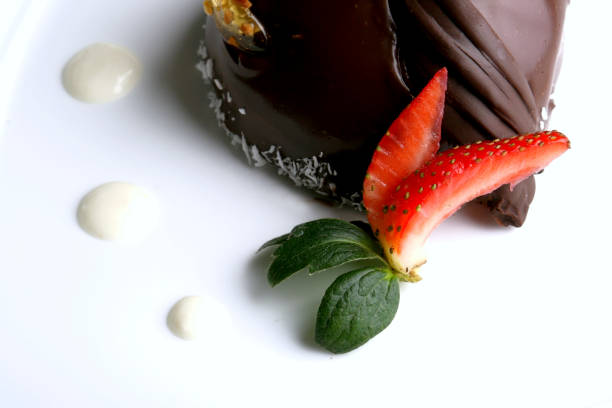 istock Chocolate dessert with caramel, coconut, strawberry and walnut. 1125825490