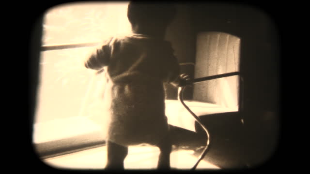 60's 8mm footage - climbs into baby chair