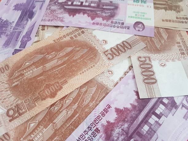 istock North Korean banknotes.Use for website/banner background, backdrop, montage menu 1125828064