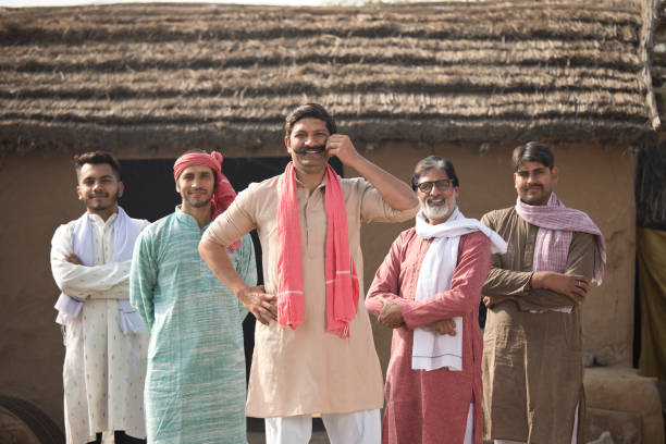Group of happy Indian farmers posing together at village