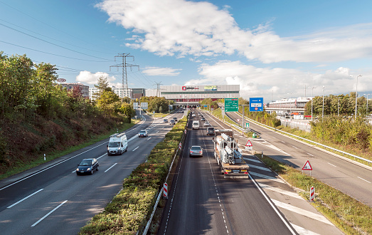 GENEVA, SWITZERLAND-SEPTEMBER 2014. Cars circulating on the highway access to the city of Geneva. It´s the tipycal scene to enter a big city.
