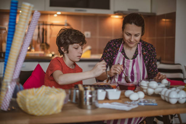 istock Family painting easter eggs 1125830064