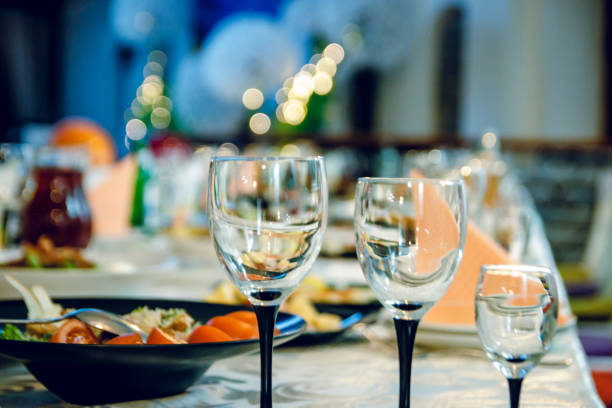istock Three glasses on the festive table with food. 1125836126