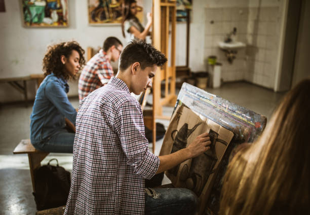 istock Group of art students drawing paintings at art studio. 1125836514