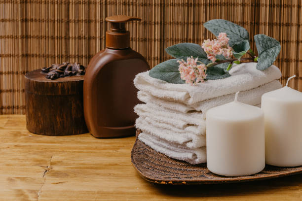 istock Spa still life with aromatic candles, flower and towel. - Image 1125838003