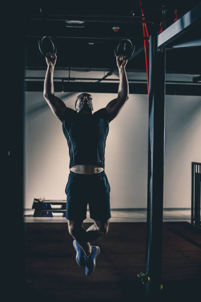 istock Muscular man is doing bodyweight training in the gym 1125838062