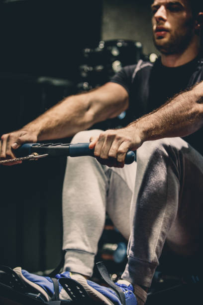 istock Athlete doing rowing workout in the gym 1125838232