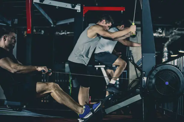 Photo of Men using exercise machines in the gym
