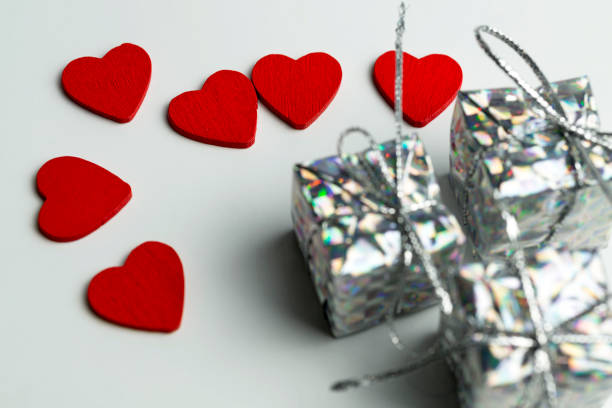 istock Valentine day background with hearts and present, top view 1125839162