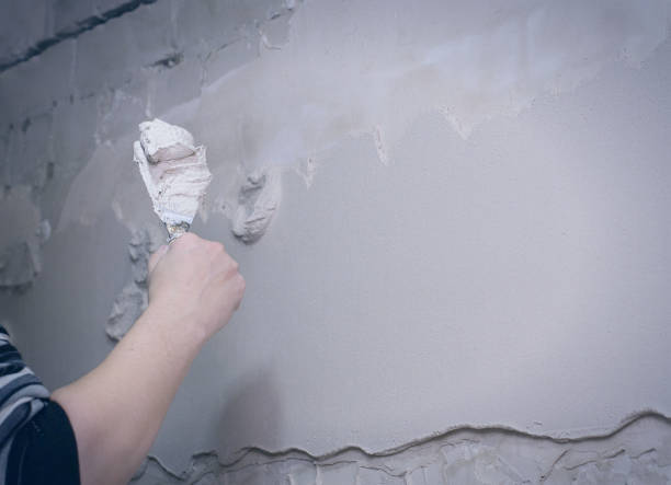 istock Renovation at home. Plasterer spreading plaster on wall. Who plaster wall plaster master. 1125840637