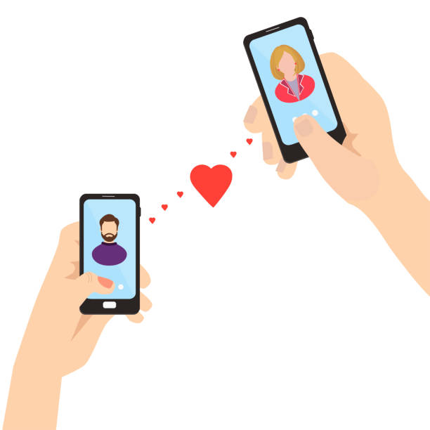 istock Man and woman holding smartphones in hand  with a heart . 1125841665