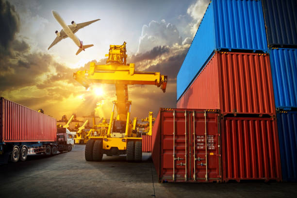 istock Logistics and transportation of Container Cargo ship and Cargo plane with working crane bridge in shipyard at sunrise, logistic import export and transport industry background 1125841845