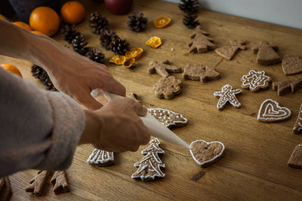 istock Christmas gingerbread icing decorating process. Homemade sweet cookies 1125841896