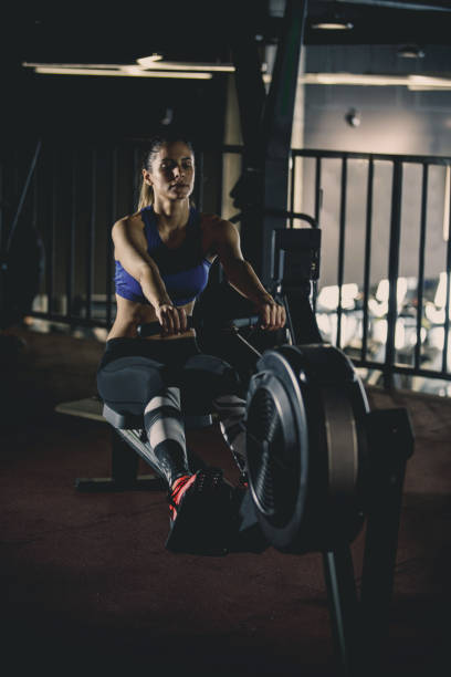 istock Woman doing seated row exercise at the gym 1125843347