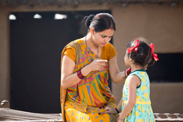 Rural woman scolding her daughter at village