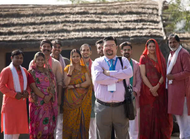 Photo of Real estate agent with group of villagers