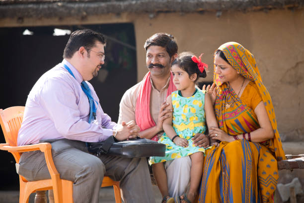 istock Real estate agent with client at village 1125844289
