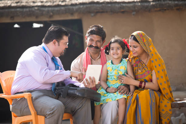 istock Real estate agent with client at village 1125844299