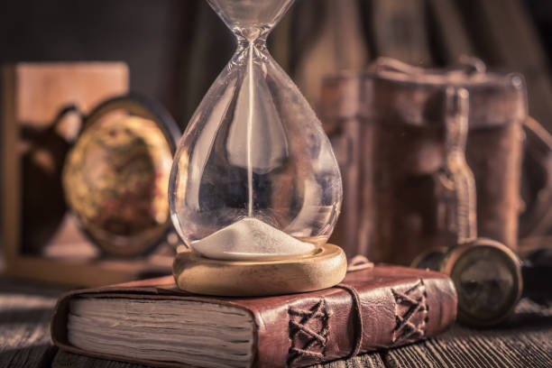 istock Hourglass and journal as a concept of journey diary 1125844807