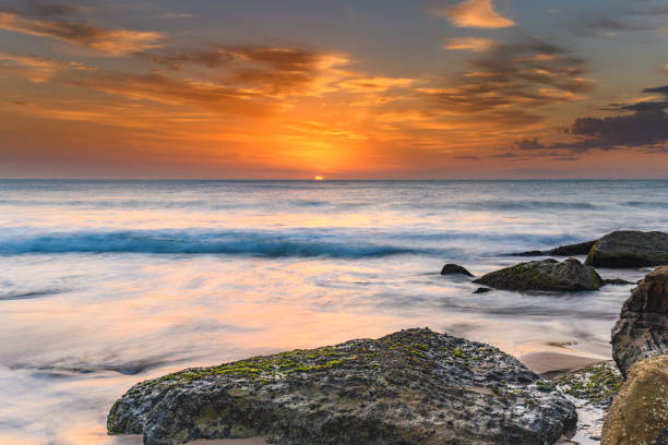 istock Orange Glow Sunrise Seascape 1125845885