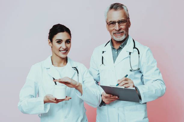 istock Doctors is Holding Clipboard and White Box 1125846613