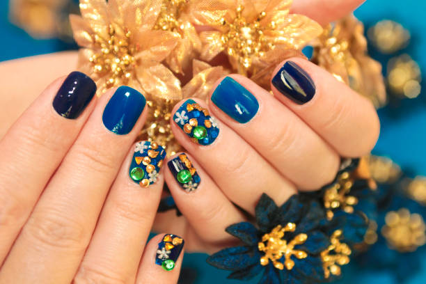 istock Bright blue manicure with the design of rhinestones. 1125848154