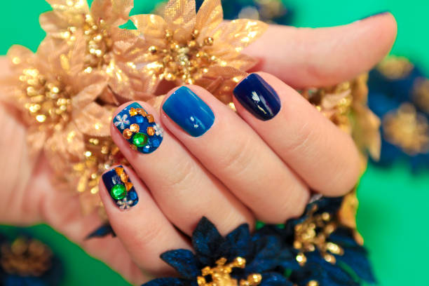 istock Bright blue manicure with the design of rhinestones. 1125848176