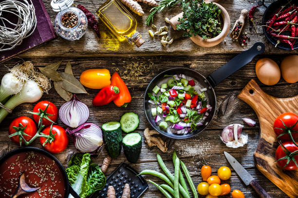 cooking fresh organic vegetables - vegan food still life horizontal image imagens e fotografias de stock