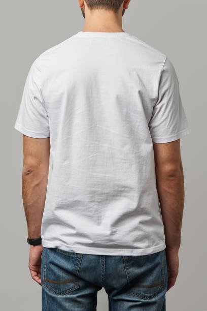 istock back view of man in white t-shirt with copy space isolated on grey 1125851038