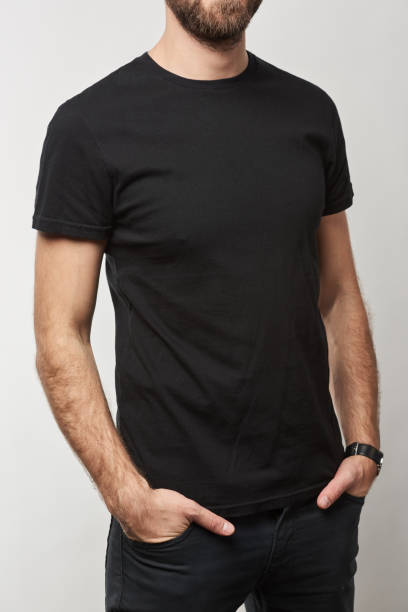 istock cropped view of man in basic black t-shirt with copy space isolated on white 1125851074