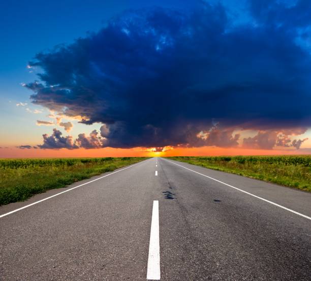 istock asphalt road to a sunset 1125852379