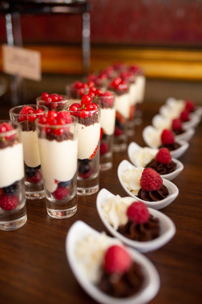 istock Berries with mousse served in shot glasses and ceramic bowls 1125852721