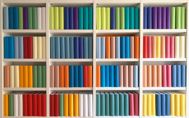 colorful generic books in white book shelves - library book shelf generic imagens e fotografias de stock