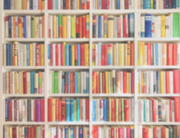 defocused library background, fully packed with books, multi colored, unidentifiable book titles - library book shelf generic imagens e fotografias de stock