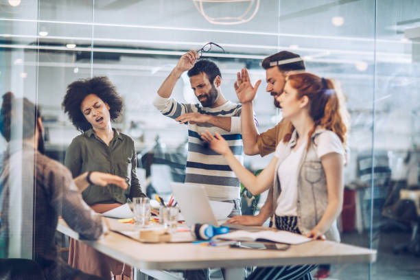 istock Group of frustrated freelance workers having problems in the office. 1125855089