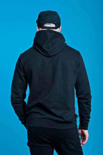 Back view of young man in black clothes