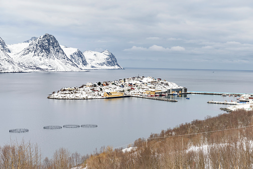 View on Husøy, Senja fishing village  in the Øyfjorden in Troms County in  Northern Norways during winter.