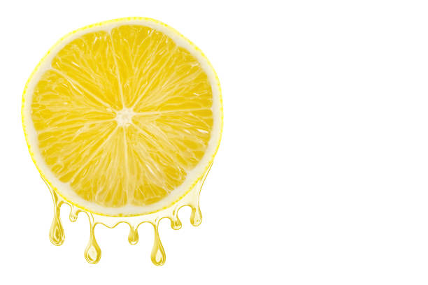 istock Sliced lemon with a juice dropping from it, isolated on white background 1125856620